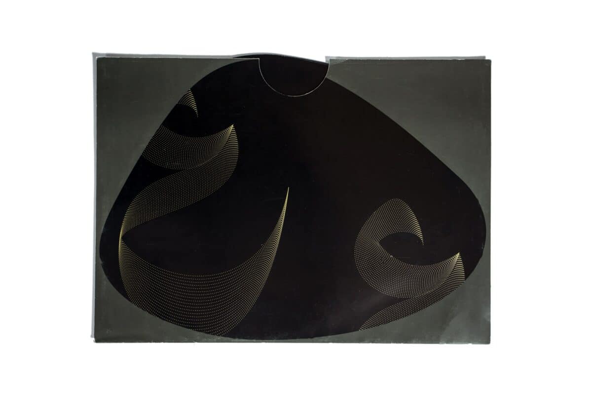 Dotted Placemats Set of 12 A set of 12 paper placemats, in an organic shape, with a grey base color and golden-print dotted Arabic calligraphy pattern.